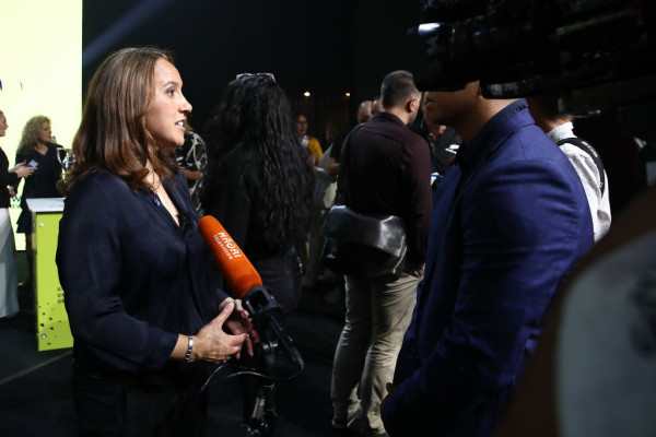 image of Farah Palmer talking to media