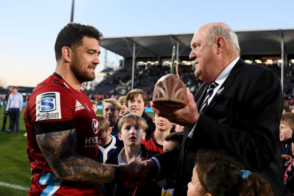 image of Stewart Mitchell presenting the Super Rugby Aotearoa trophy